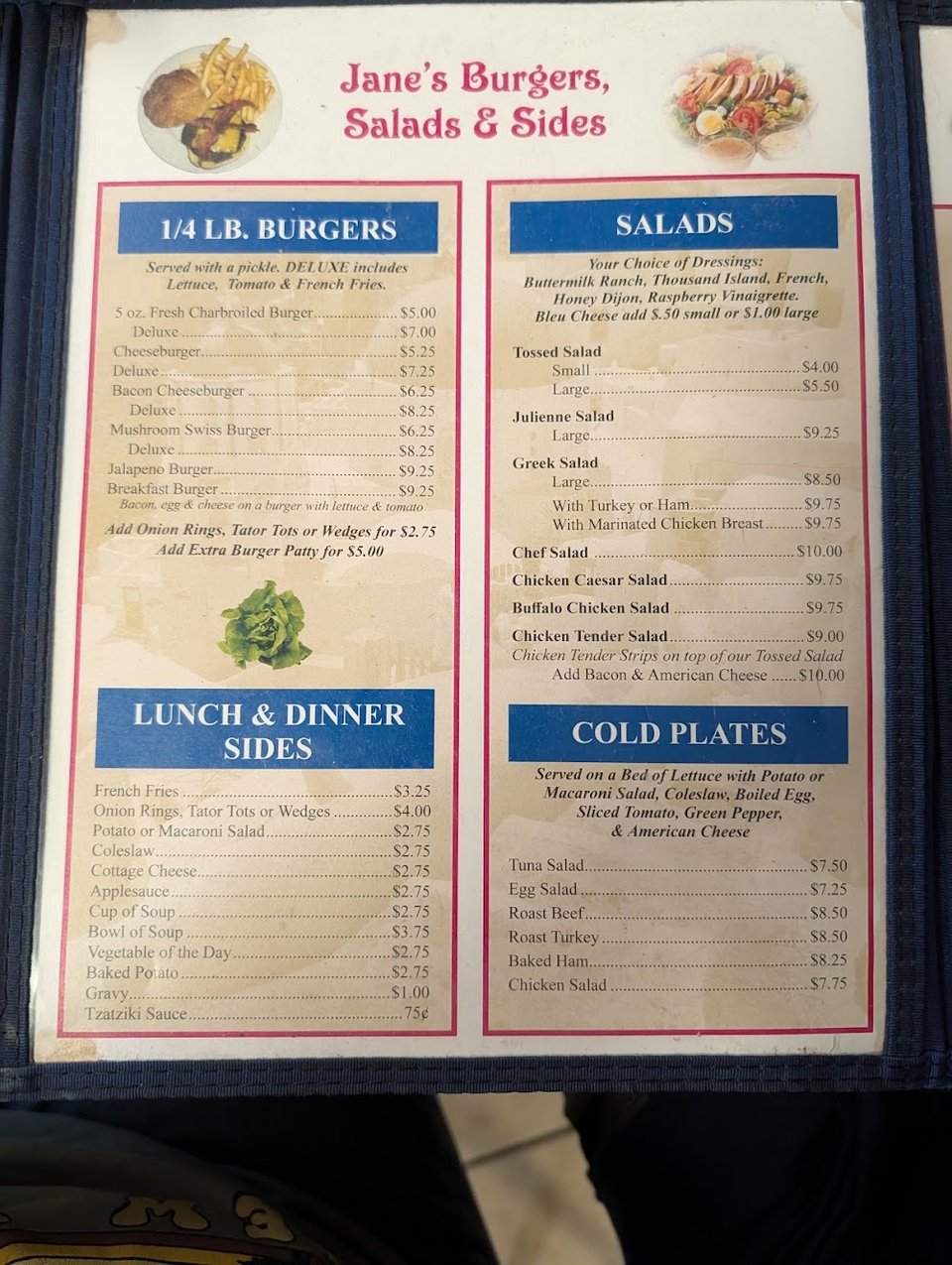 Close-up of a diner menu with breakfast-style selections.